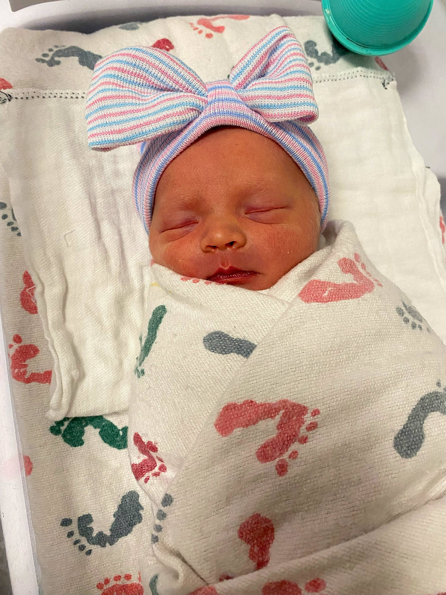 Maelynn is registered to the contest to win money with this photo: baby, baby_products, baby_safety, baby_sleeping, baby_toddler_clothing, bedding, bedtime, carmine, child, comfort, face, green, hat, linens, pattern, person, room, sleeve, textile, toddler