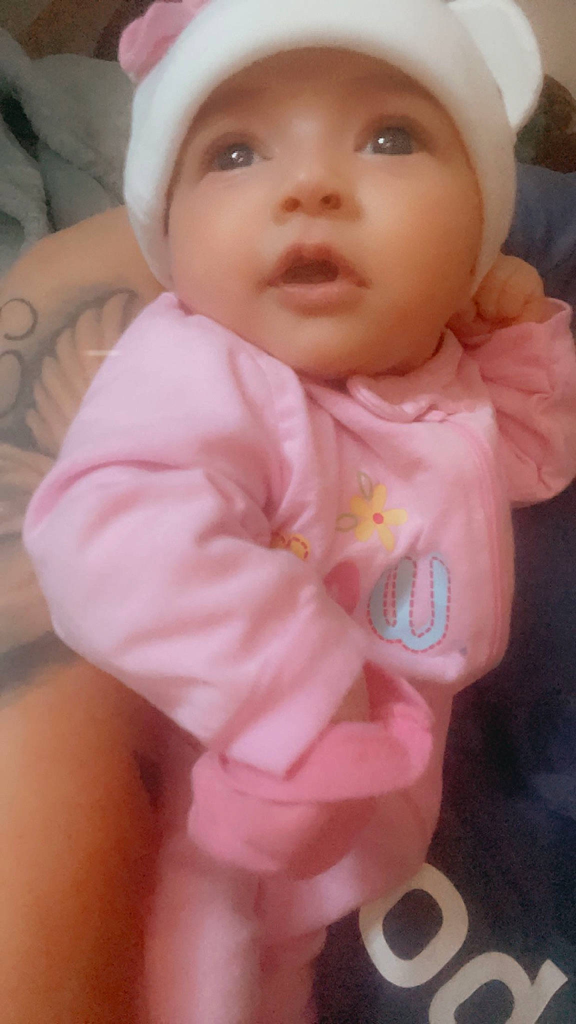 Genevieve is registered to the contest to win money with this photo: baby, baby_toddler_clothing, cap, cheek, child, chin, eye, eyelash, face, fashion_accessory, fun, happy, hat, headwear, iris, lip, nose, person, pink, skin