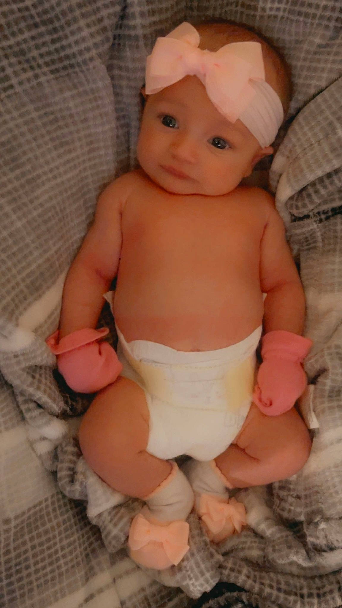 Genevieve is registered to the contest to win money with this photo: abdomen, arm, baby, baby_toddler_clothing, cheek, chest, finger, headwear, knee, leg, lip, mouth, nail, person, pink, skin, stomach, textile, thigh, thumb