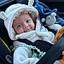 Mattéo a rejoint le concours — aidez-le/la à gagner de superbes lots ! baby, car_seat, white_clothing, hooded_outfit, toy, pacifier, blanket, smiling, face, blue_eyes, seatbelt, plush_toy, child, indoor, cute, infant, happy, closeup, person, car_interior