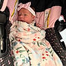 baby, blanket, bow, car_seat, child, clothing, cute, face, floral, headband, infant, infant_car_seat, pink, portrait, resting, seat, soft, toddler, warning_label, young_child