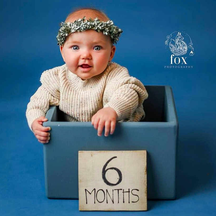 Juniper joined the competition — help win amazing prizes! baby, box, clothing, crawling, face, happy, hat, head, newborn, number, person, photoframe, photography, portrait, sitting, sleeve, smile, surprised, symbol, text