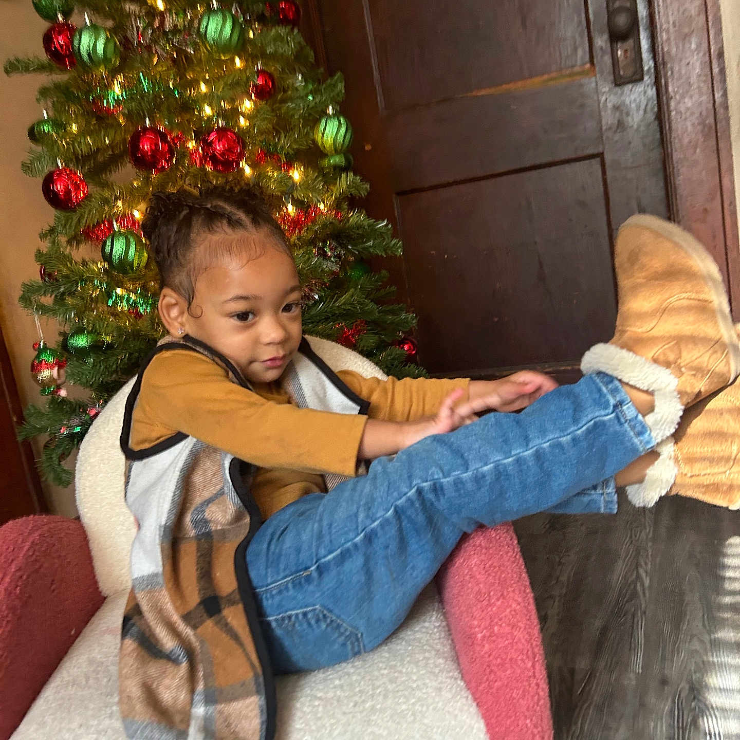 Zolah joined the competition — help win amazing prizes! blanket, christmas, christmasdecorations, christmastree, clothing, face, festival, footwear, hair, happy, head, hugging, jeans, pants, person, photography, portrait, shoe, sitting, smile