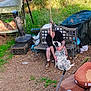 Bleu is registered to the contest to win money with this photo: affection, bench, black_tshirt, brown_boots, cage, casual, cover, dirt_ground, dog, fence, grass, greenery, leisure, man, outdoor, pet, rope, rustic, tattoo, yard