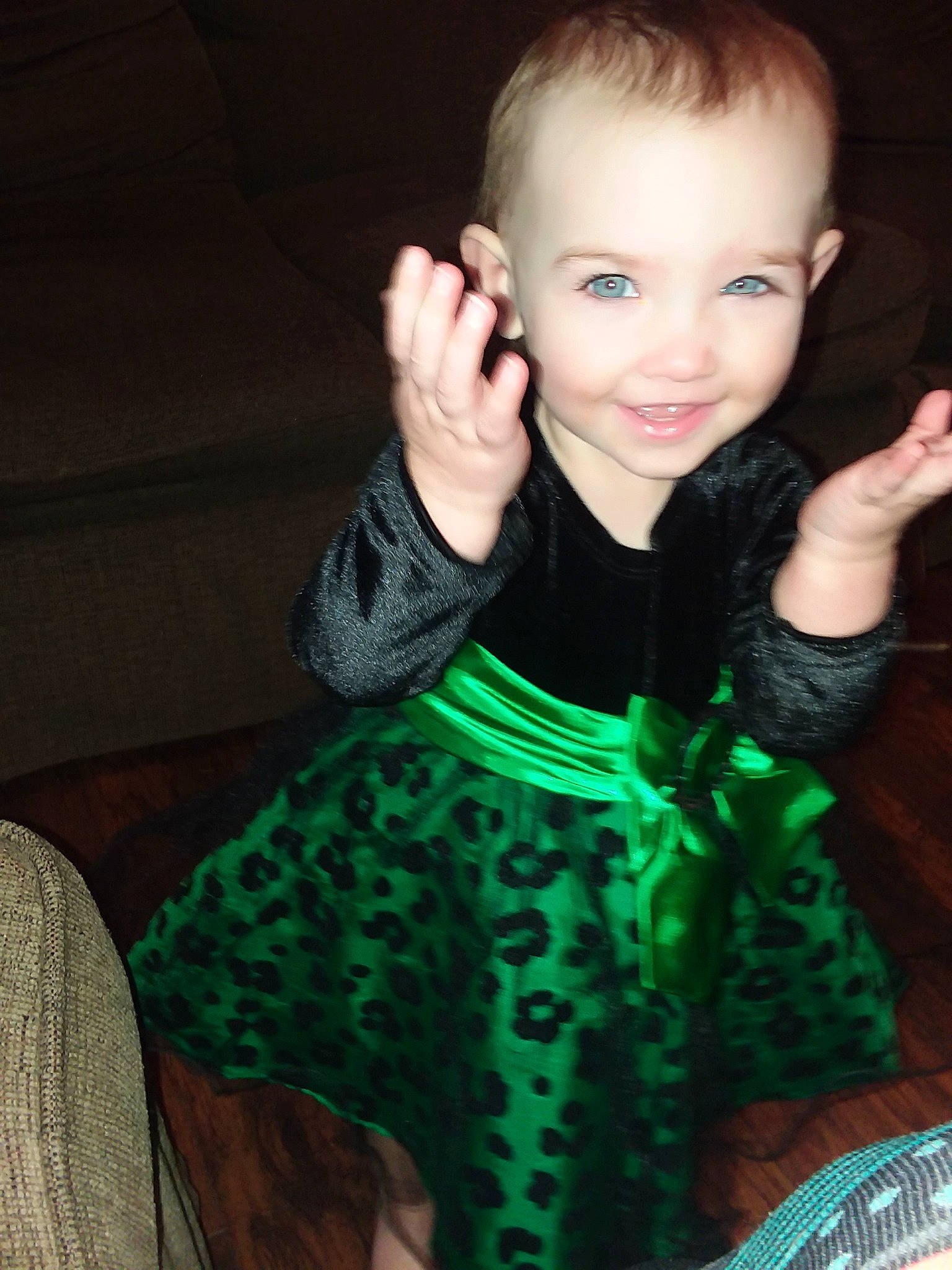 Kinsley is registered to the contest to win money with this photo: cheek, child, child_model, clothing, ear, eye, finger, fun, girl, green, hair, hairstyle, hand, human_hair_color, joy, organ, outerwear, person, skin, smile