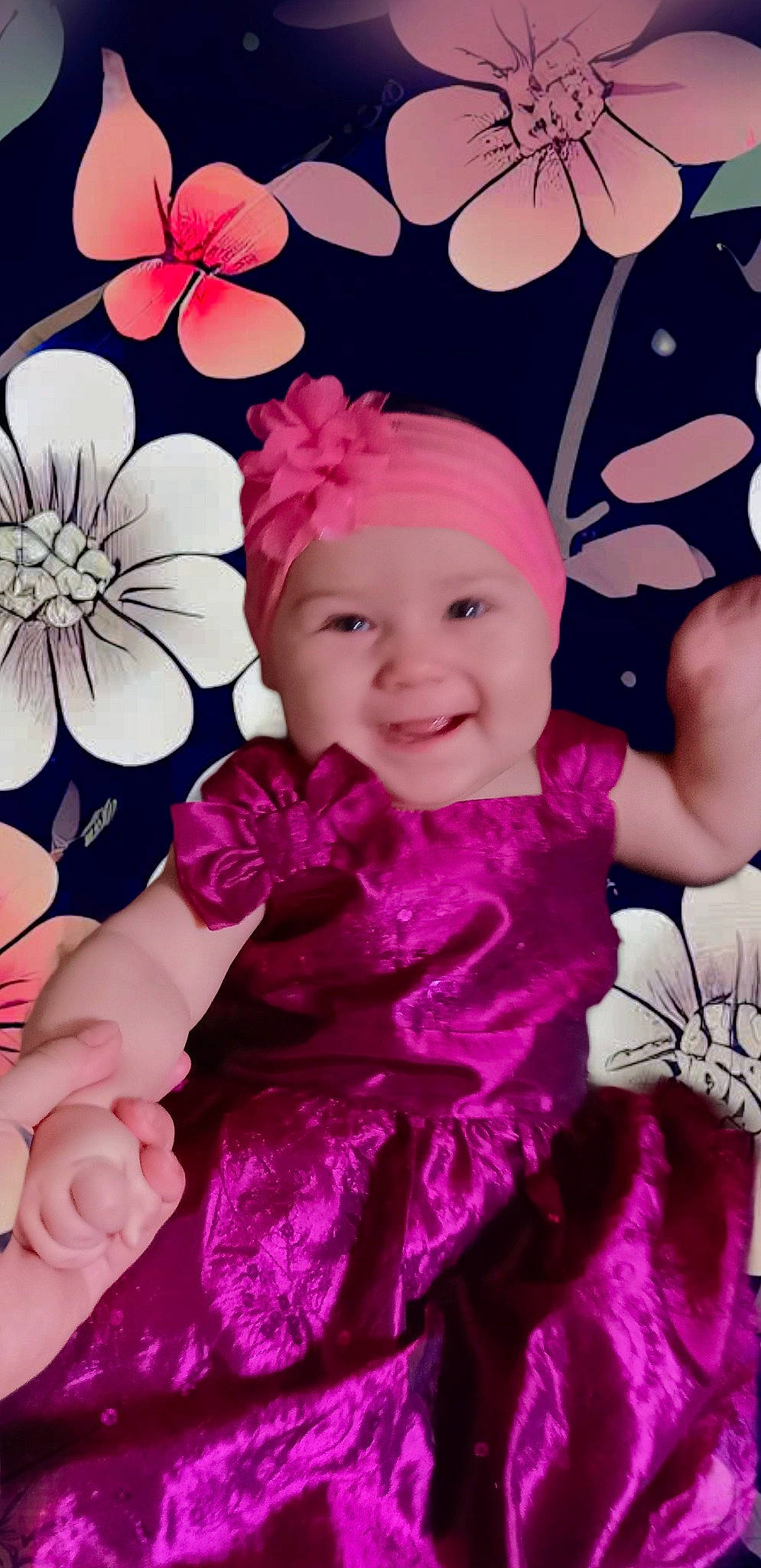 Liliana participe au concours pour gagner de l'argent avec cette photo : baby, baby_toddler_clothing, child, facial_expression, flower, happy, headband, headpiece, headwear, joy, magenta, pattern, person, petal, pink, product, purple, sleeve, smile, textile