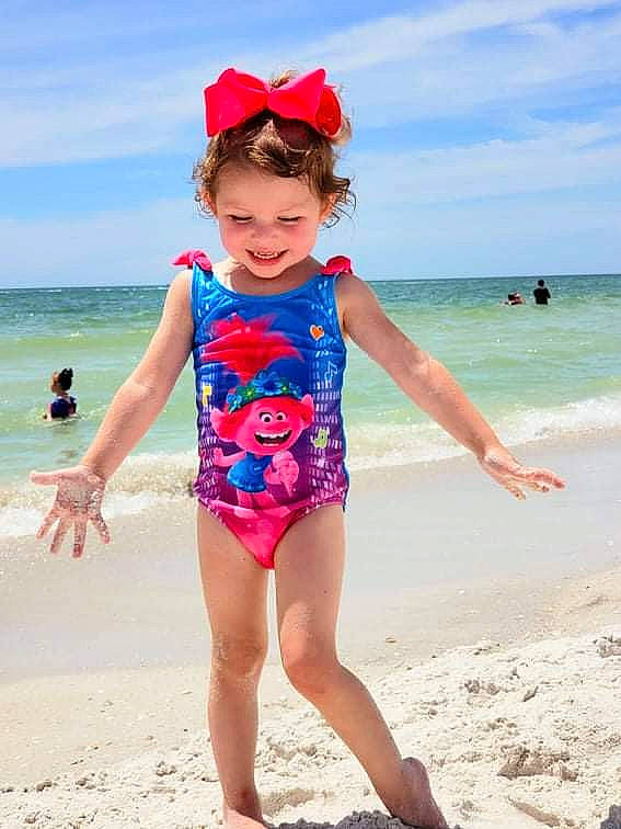 Caitlyn joined the competition — help win amazing prizes! azure, beach, blue, cloud, eye, happy, headgear, human_body, joy, leg, leisure, one_piece_swimsuit, people_on_beach, person, sky, sleeve, smile, summer, thigh, toddler
