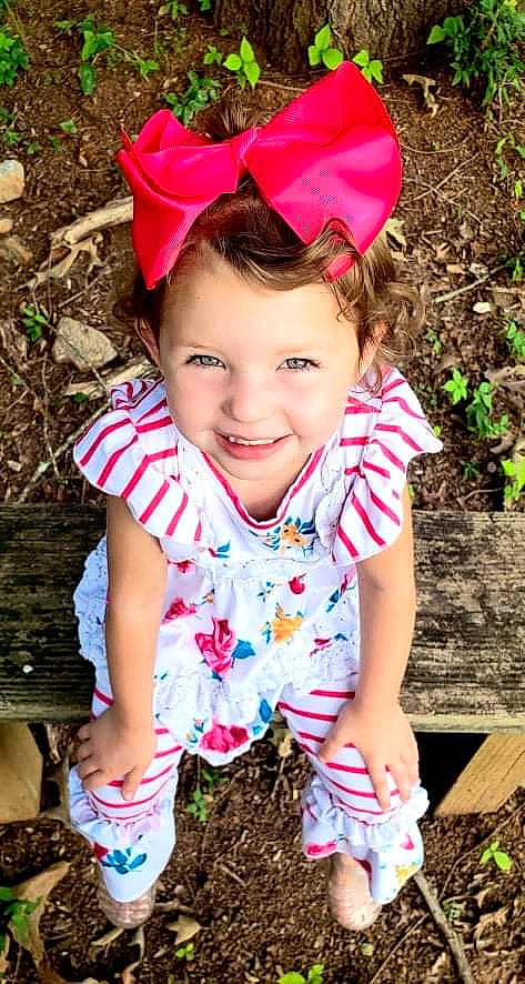 Caitlyn joined the competition — help win amazing prizes! blue, botany, cool, eye, face, facial_expression, grass, green, hair, happy, head, joy, lip, people, people_in_nature, person, photograph, pink, sleeve, smile