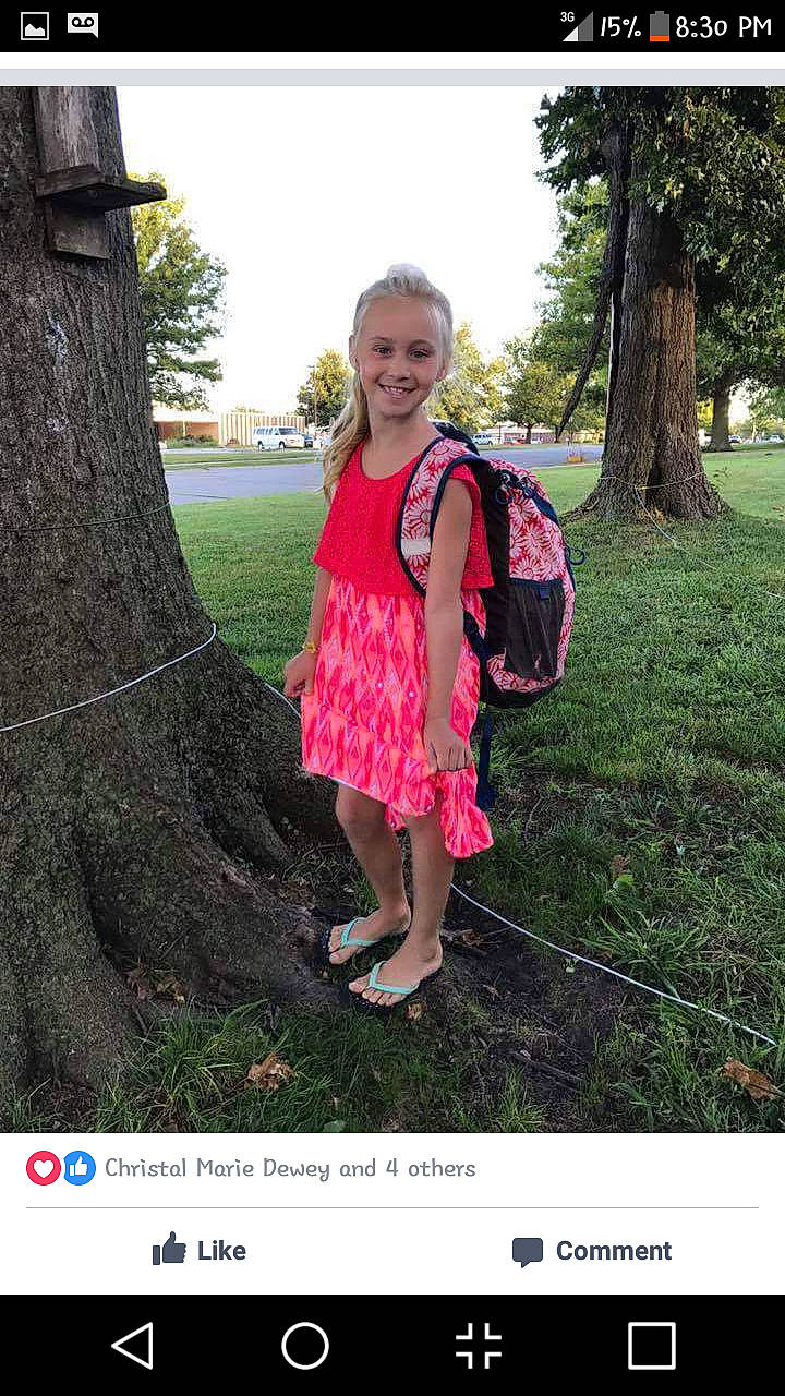 Remington is registered to the contest to win money with this photo: dress, footwear, formal_wear, grass, grass_family, happy, human_body, joy, lawn, magenta, nature, pattern, people_in_nature, person, pink, plant, sky, sleeve, smile, standing