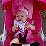 baby, stroller, pink, headband, flower, child, infant, outdoor, seatbelt, clothing, happy, cute, person, sitting, baby_girl, face, hand, blue_eyes, canopy, toy_bar