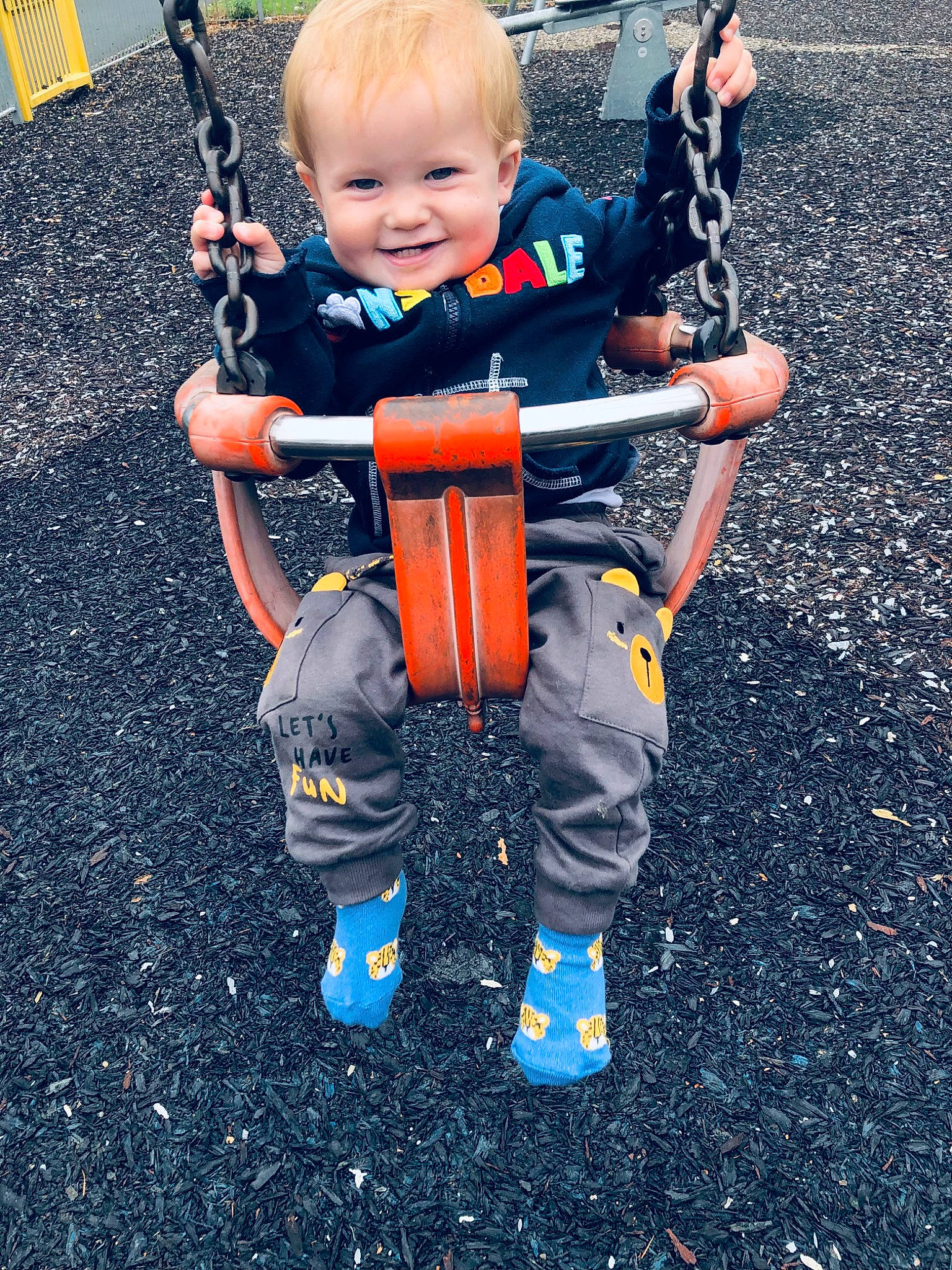 George joined the competition — help win amazing prizes! asphalt, baby, baby_toddler_clothing, blue, child, city, electric_blue, fun, happy, joy, leisure, outdoor_play_equipment, person, play, playground, recreation, sitting, smile, soil, t_shirt
