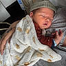 Lio a rejoint le concours — aidez-le/la à gagner de superbes lots ! newborn, baby, sleeping, blanket, hat, wristband, tattoo, person, skin, hand, hospital, bed, comfort, rest, cozy, infant, clothing, closeup, indoor, portrait