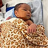 newborn, baby, blanket, heart_pattern, towel, infant, resting, sleepy, indoors, human, skin, hand, face, cute, soft, cozy, newborn_baby, wrapped, lying_down, peaceful