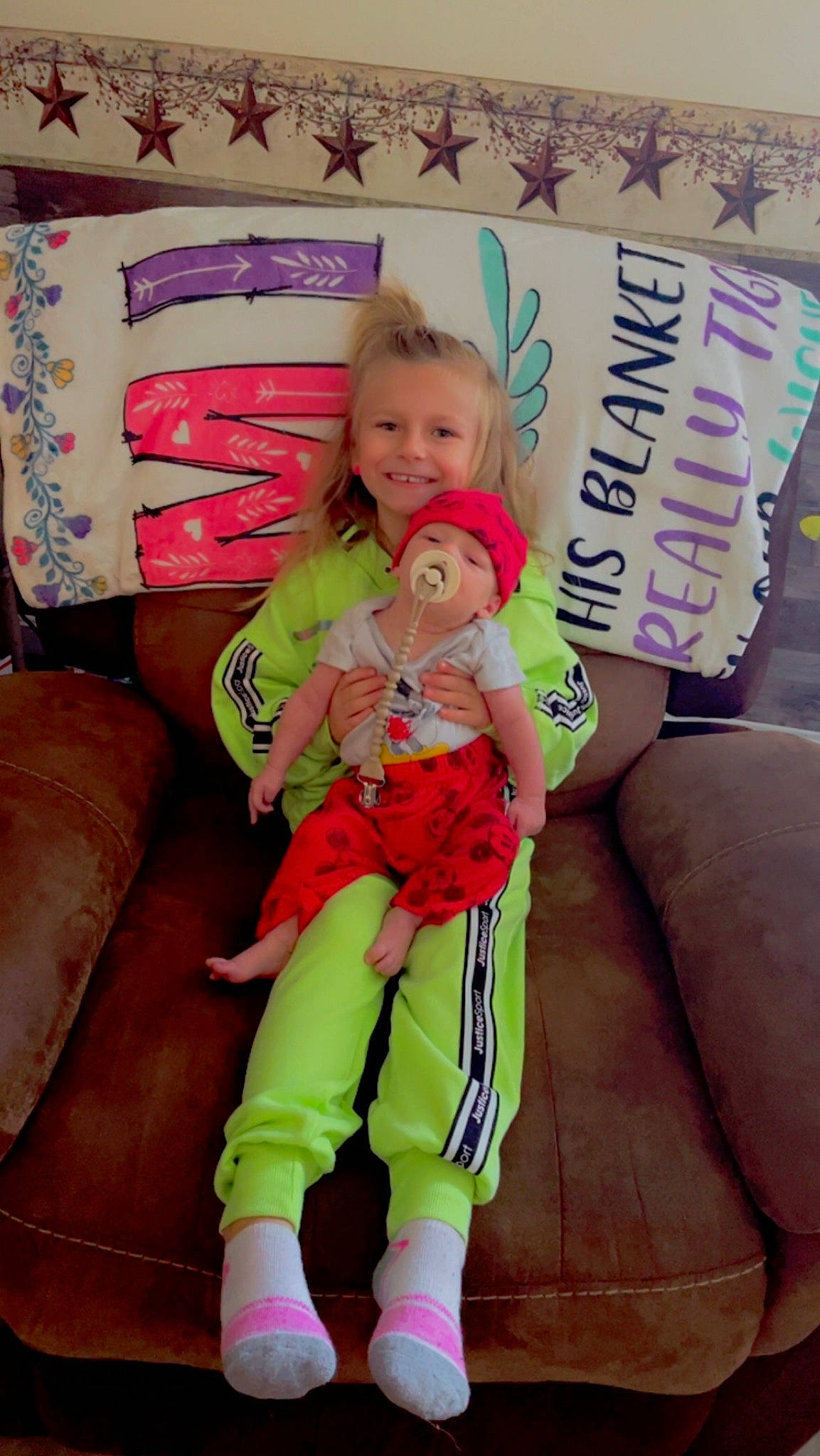 Waylon joined the competition — help win amazing prizes! baby, baby_products, baby_toddler_clothing, child, comfort, event, eye, finger, happy, headwear, human_leg, joy, lap, leg, magenta, person, pink, sitting, skin, smile