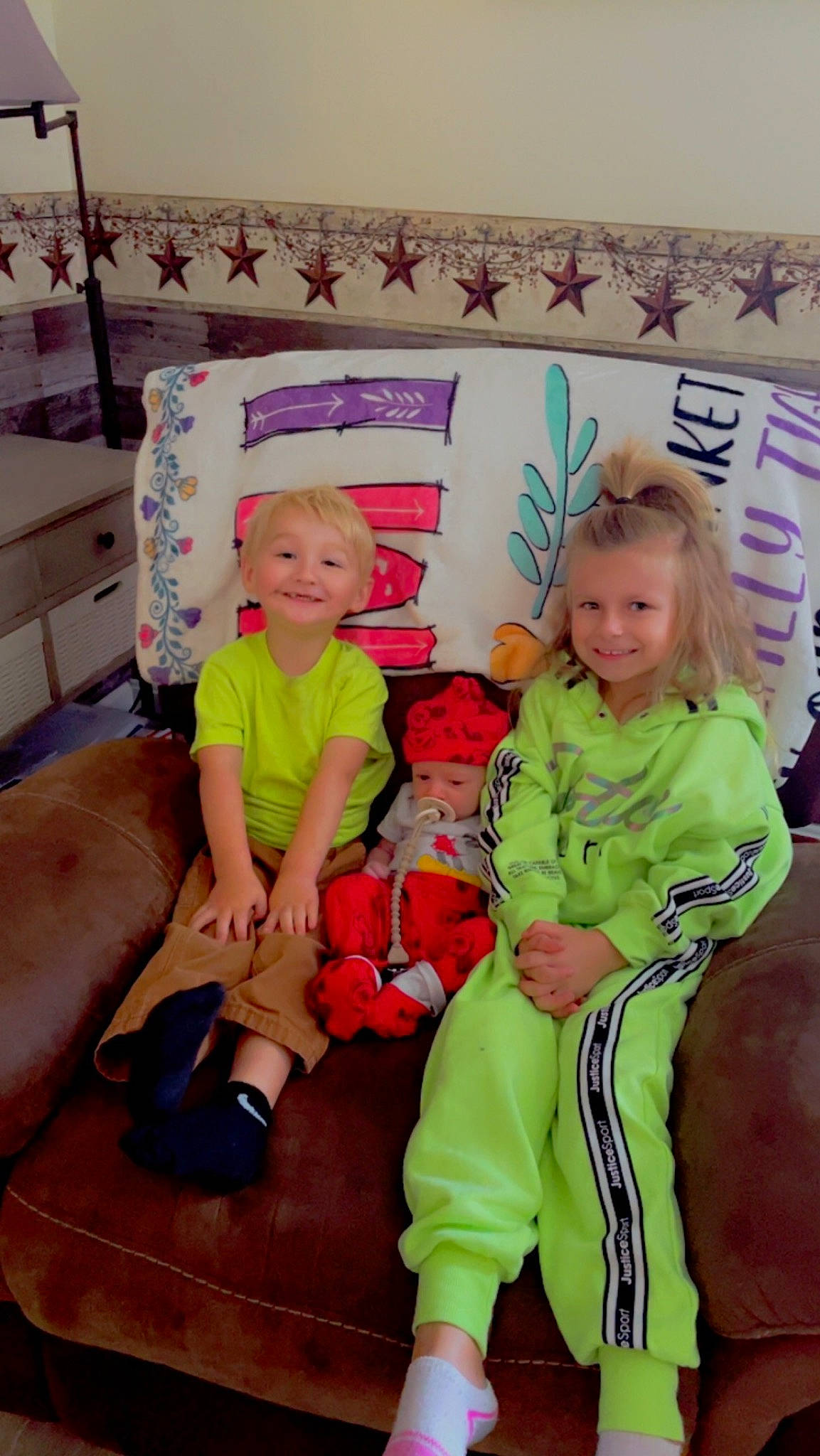 Waylon is registered to the contest to win money with this photo: baby_toddler_clothing, child, comfort, couch, event, face, fun, happy, head, headwear, holiday, joy, lap, leg, leisure, magenta, person, pink, room, sitting