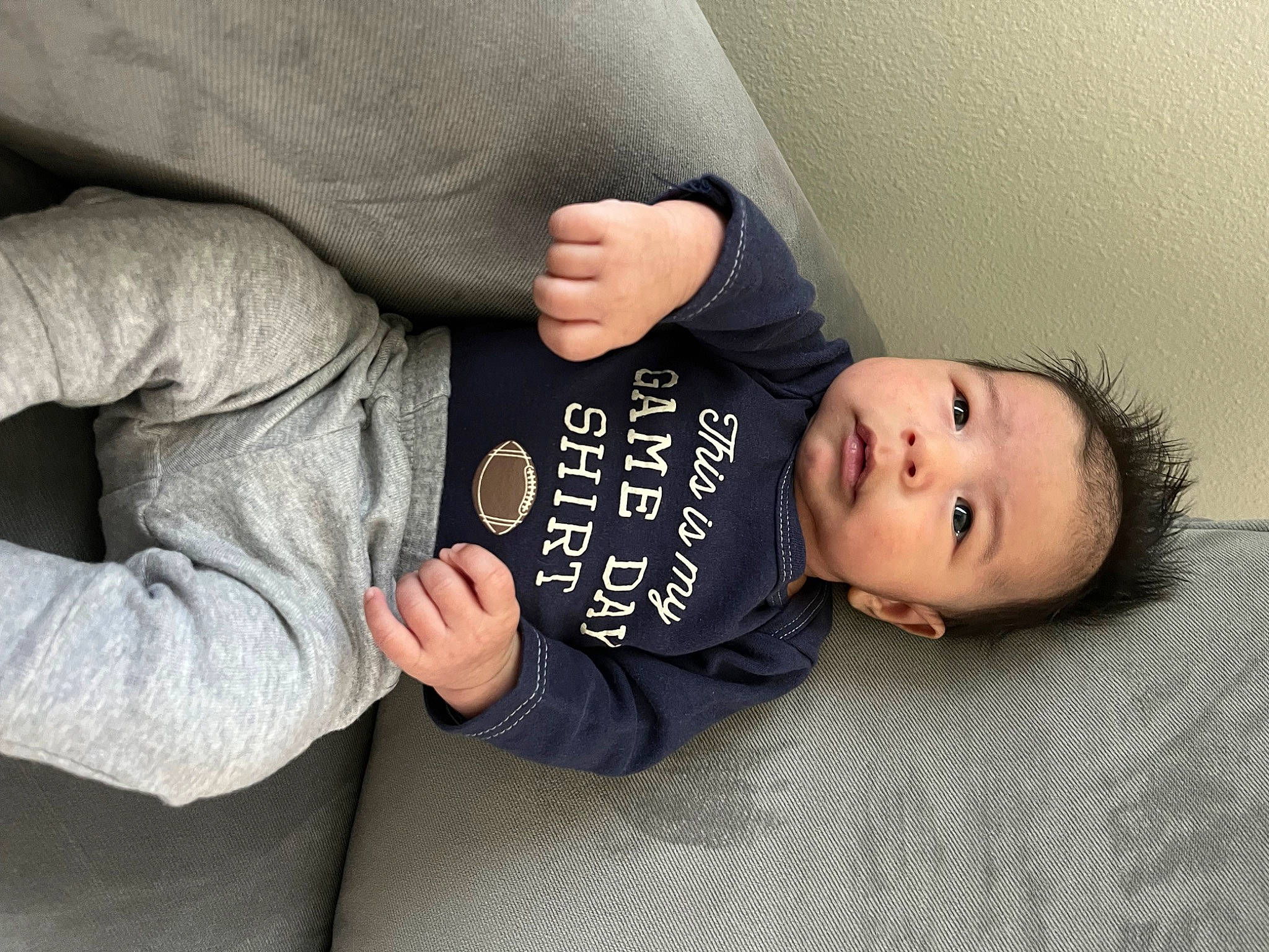 Lionel is registered to the contest to win money with this photo: arm, baby_toddler_clothing, child, comfort, elbow, finger, gesture, hand, human_body, joint, mammal, nail, people, person, skin, sleeve, t_shirt, thumb, toddler, vertebrate