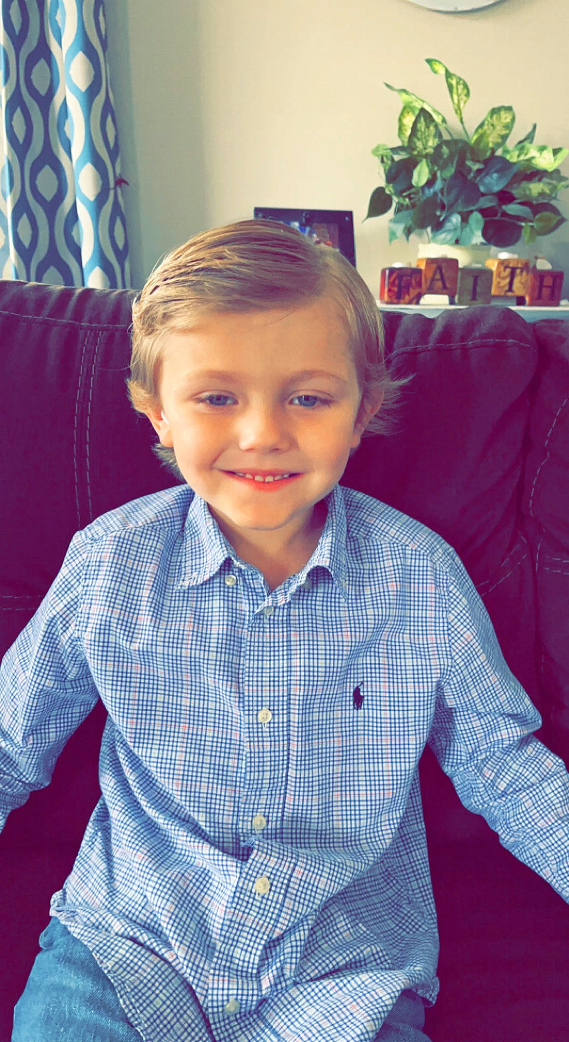 Buckley is registered to the contest to win money with this photo: cheek, chin, dress_shirt, electric_blue, eye, flowerpot, forehead, fun, hair, hairstyle, happy, head, houseplant, iris, joy, person, plaid, plant, sleeve, smile