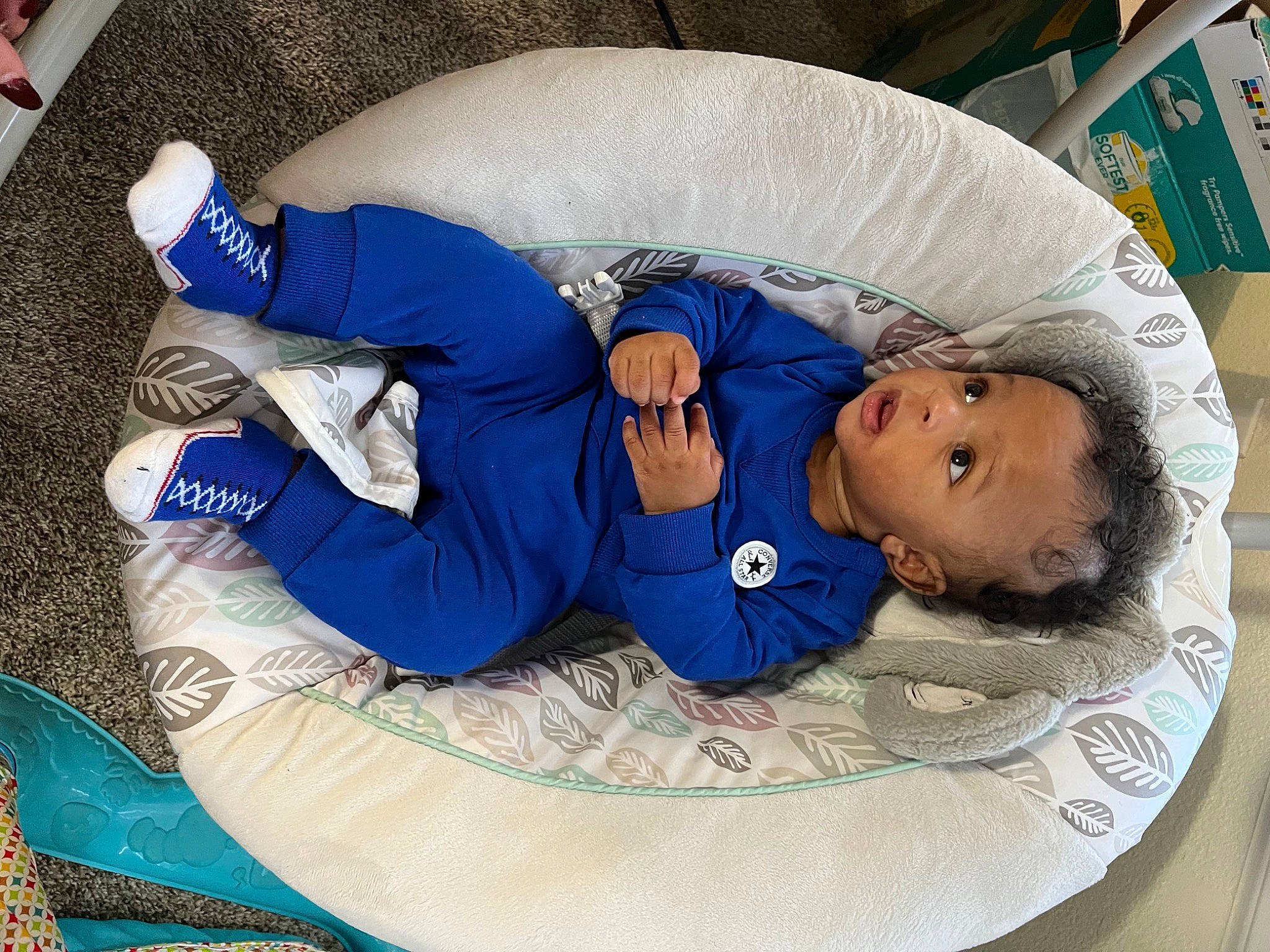 Dior is registered to the contest to win money with this photo: baby, baby_products, baby_safety, baby_sleeping, baby_toddler_clothing, bedtime, blue, child, comfort, electric_blue, infant_bed, lap, linens, nap, pattern, person, sitting, sleep, sleeve, surprise