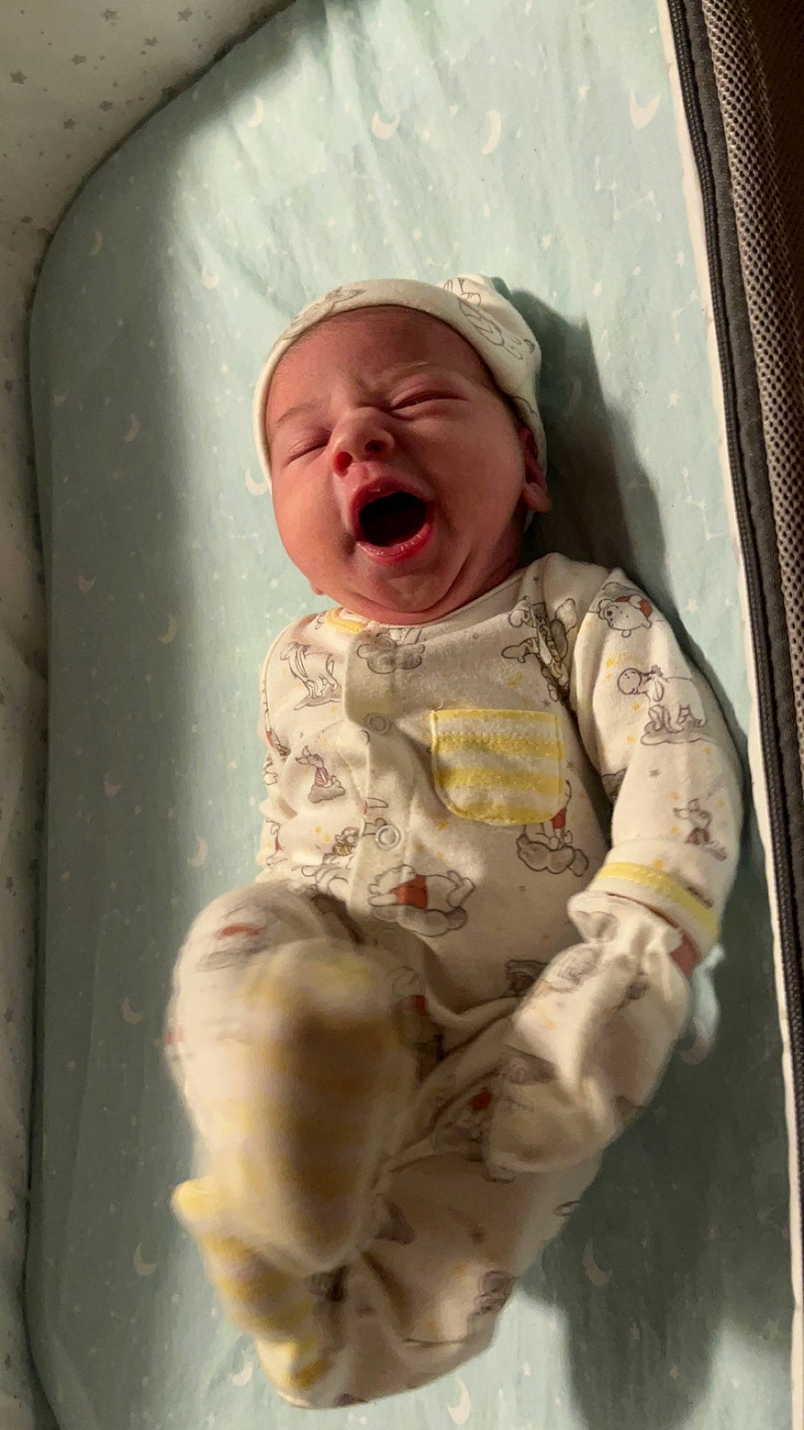 Allison is registered to the contest to win money with this photo: baby, baby_products, baby_safety, baby_toddler_clothing, cheek, child, comfort, eye, fun, head, human_body, linens, mouth, person, personal_protective_equipment, room, sitting, skin, sleeve, textile