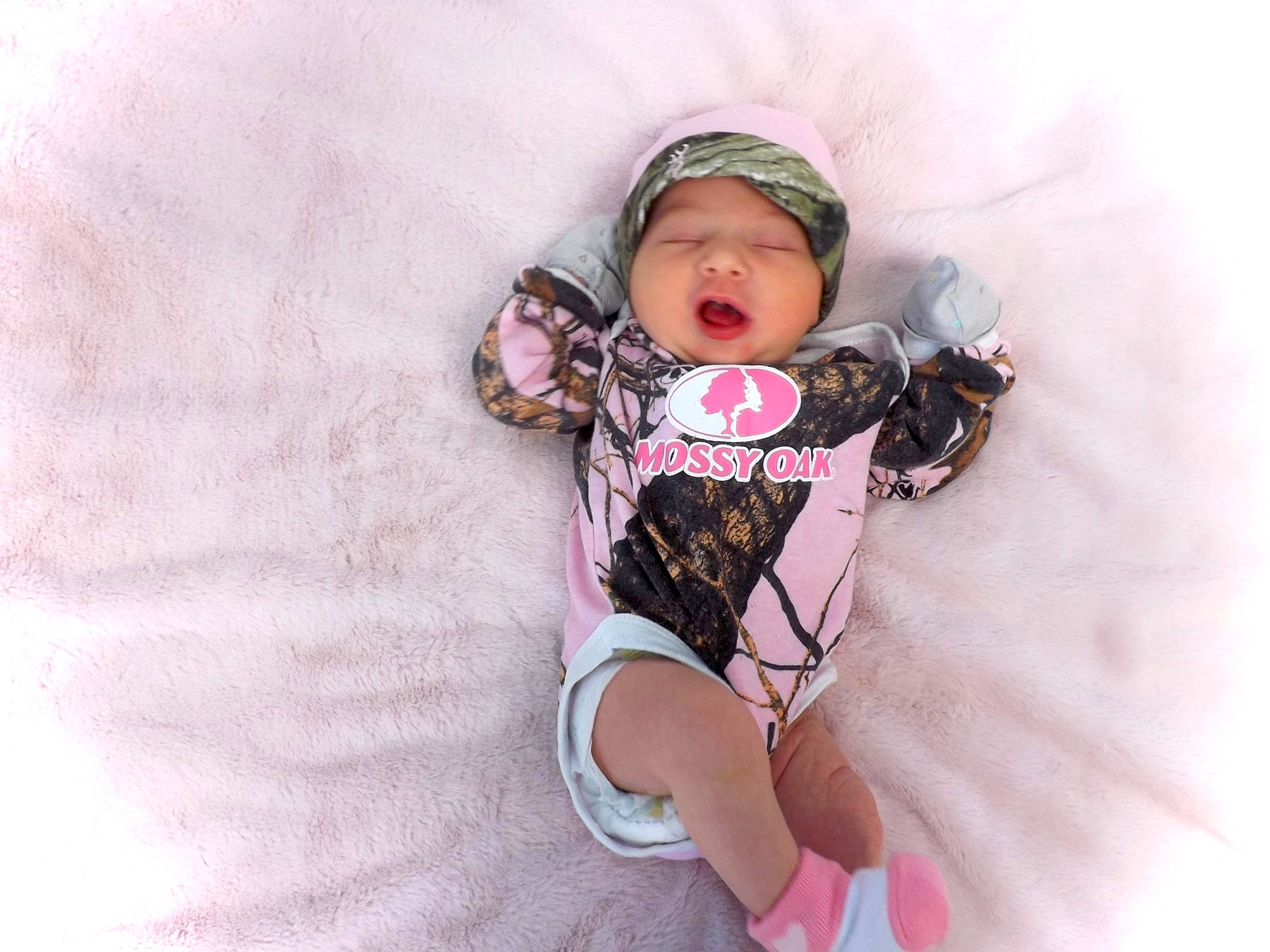 Allison is registered to the contest to win money with this photo: baby, baby_products, baby_safety, baby_sleeping, baby_toddler_clothing, child, comfort, finger, goggles, headwear, leg, linens, magenta, pattern, person, personal_protective_equipment, pink, sleeve, sock, thigh