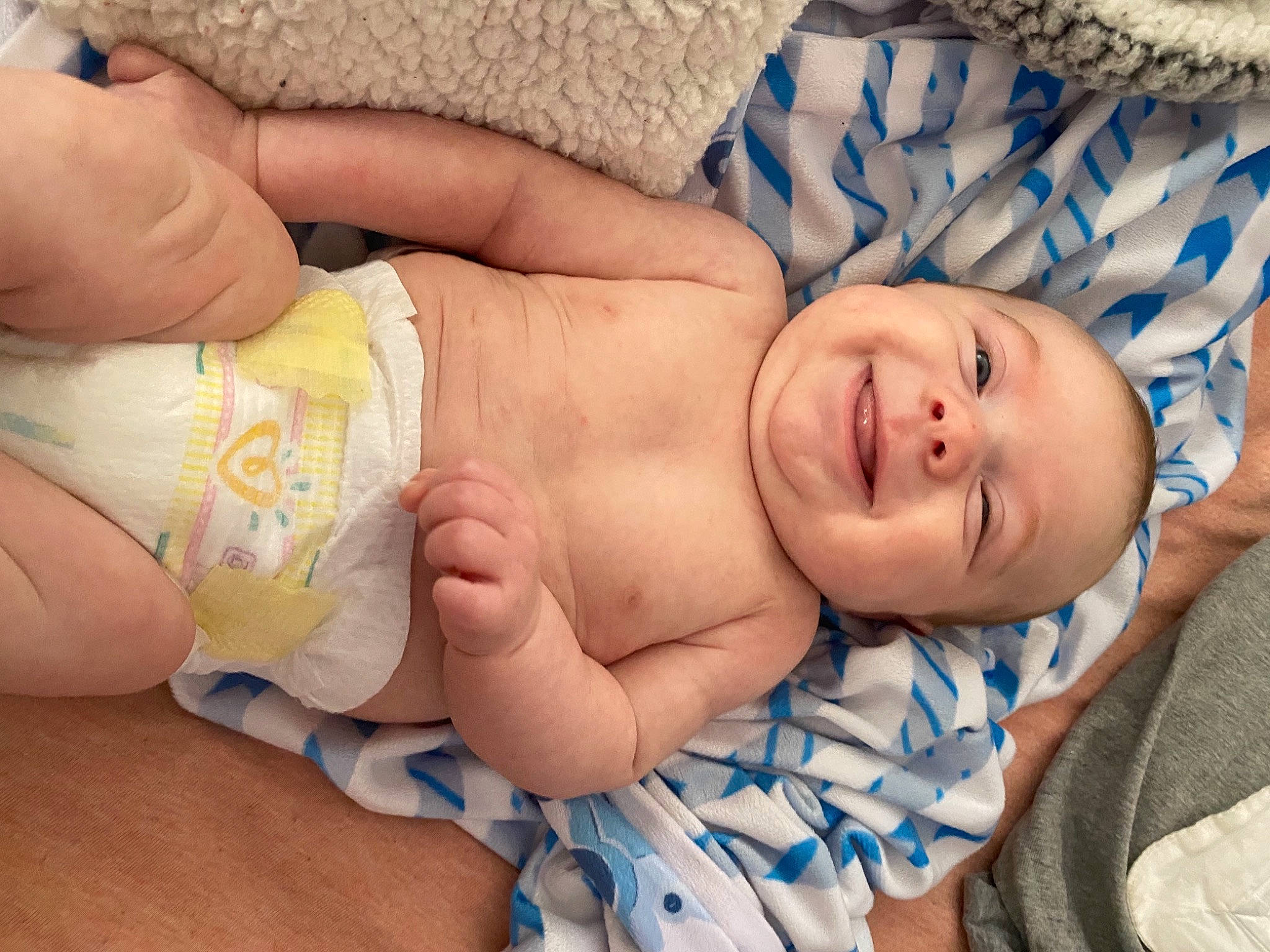 Boston is registered to the contest to win money with this photo: abdomen, baby, baby_products, baby_sleeping, baby_toddler_clothing, cheek, child, comfort, diaper, finger, hand, human, joy, linens, nail, nose, person, skin, stomach, thumb