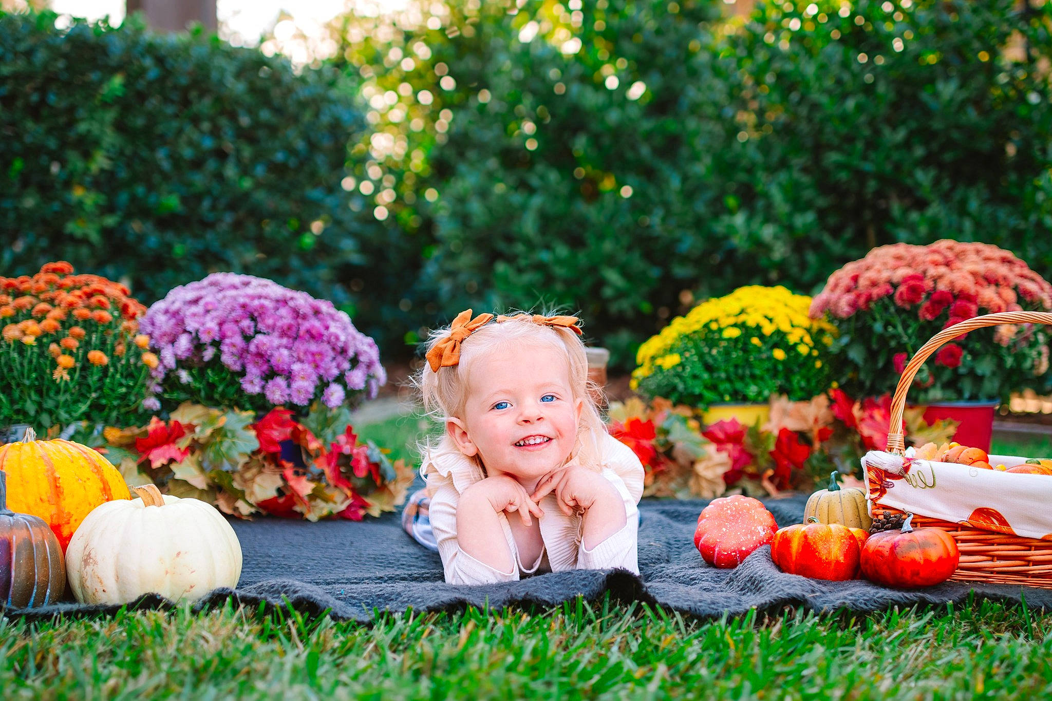 Sterling is registered to the contest to win money with this photo: baby_toddler_clothing, botany, flower, fun, grass, happy, hat, joy, leaf, leisure, nature, orange, people_in_nature, person, petal, pink, plant, smile, summer, toddler
