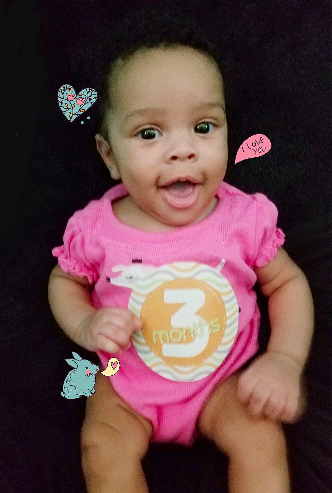 Ava is registered to the contest to win money with this photo: cheek, child, face, facial_expression, finger, fun, girl, hand, happiness, head, infant, mouth, nose, person, pink, product, skin, smile, toddler