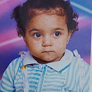 Soukaïna a rejoint le concours — aidez-le/la à gagner de superbes lots ! toddler, child, portrait, curly_hair, striped_shirt, blue, white, green_hairband, serious_expression, studio_background, retro_style, neon_lights, baby, person, cute, face, young_child, photo_studio, clothing, earrings