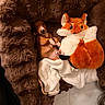 puppy, dog, brown, fluffy_bed, plush_toy, fox_toy, blanket, cute, pet, cozy, indoor, resting, soft, animal, snuggling, small, young, sleepy, fur, comfort
