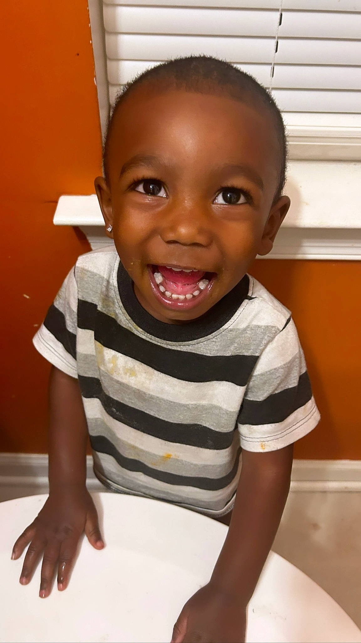 Jakari joined the competition — help win amazing prizes! baby_toddler_clothing, cheek, child, elbow, eye, eyelash, flooring, fun, happy, joy, lip, nose, person, room, sitting, skin, sleeve, smile, standing, t_shirt