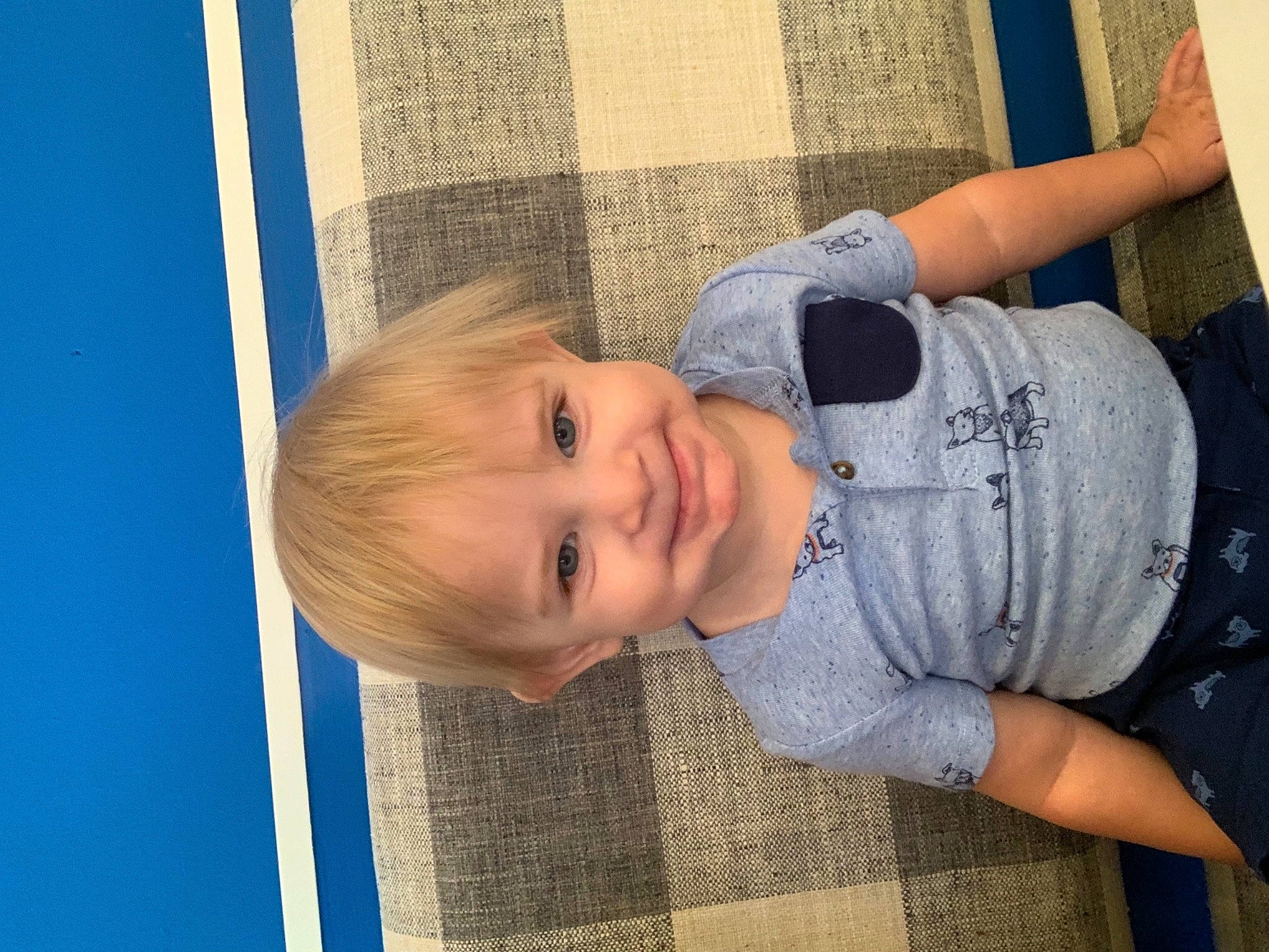 Kellan is registered to the contest to win money with this photo: baby_toddler_clothing, blond, blue, cheek, child, elbow, eye, fun, gesture, grass, happy, human_body, joy, leisure, pattern, person, skin, smile, standing, textile
