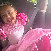 Valanna joined the competition — help win amazing prizes! child, girl, smiling, portrait, car, seatbelt, vehicle, pink_dress, formalwear, ruffles, jewelry, headband, seated, indoors, automotive, sunlight, window, happy, fashion, toddler