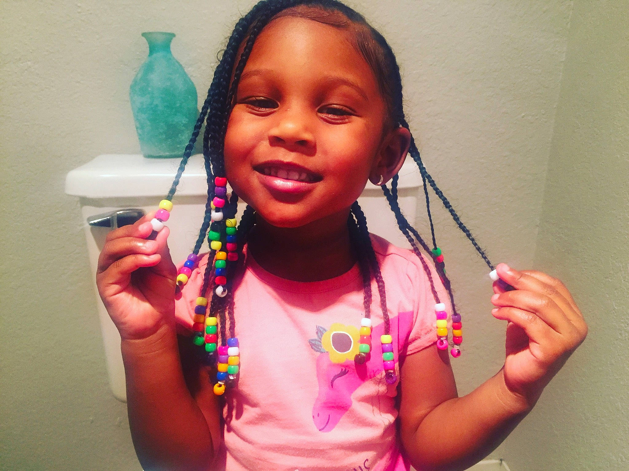 Akylah joined the competition — help win amazing prizes! black_hair, cheek, child, face, finger, forehead, hair, hair_accessory, hairstyle, happy, head, joy, lip, long_hair, neck, person, pink, shoulder, skin, smile