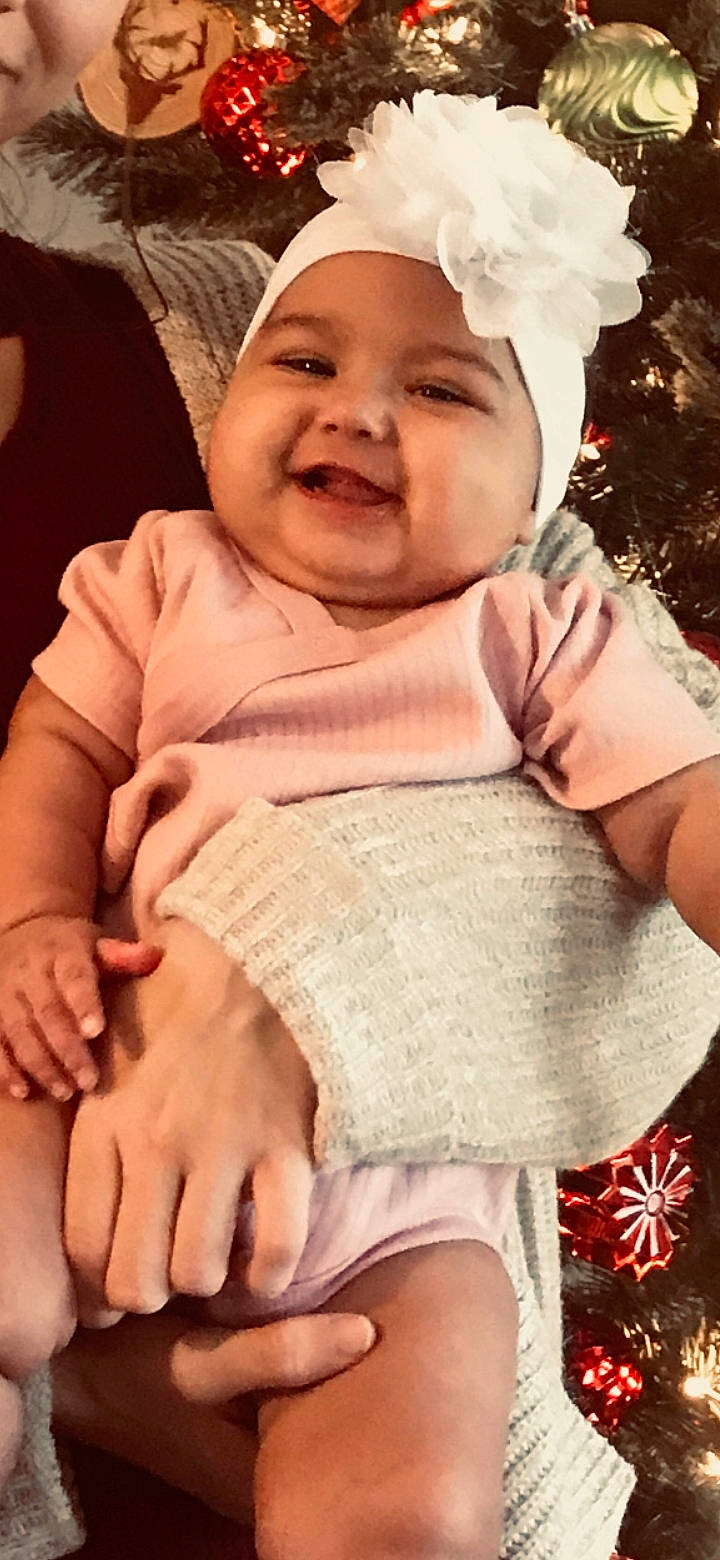 Avaya joined the competition — help win amazing prizes! baby, baby_laughing, bonnet, cheek, child, facial_expression, happy, head, headgear, headwear, laugh, person, pink, skin, smile, toddler