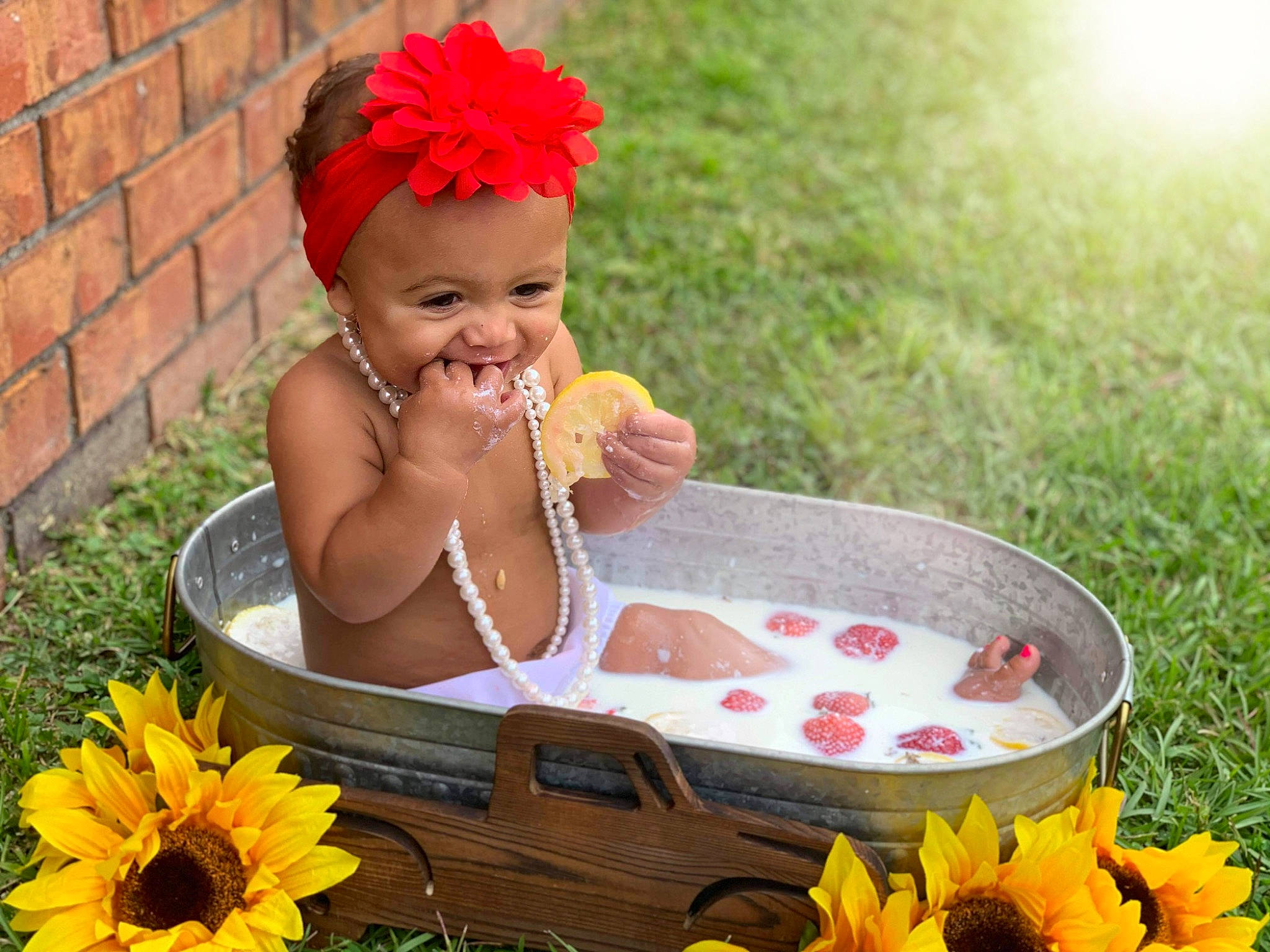 Kylance joined the competition — help win amazing prizes! baby, child, fashion_accessory, flower, grass, happy, headwear, leisure, person, petal, photography, plant, play, sitting, summer, toddler, yellow