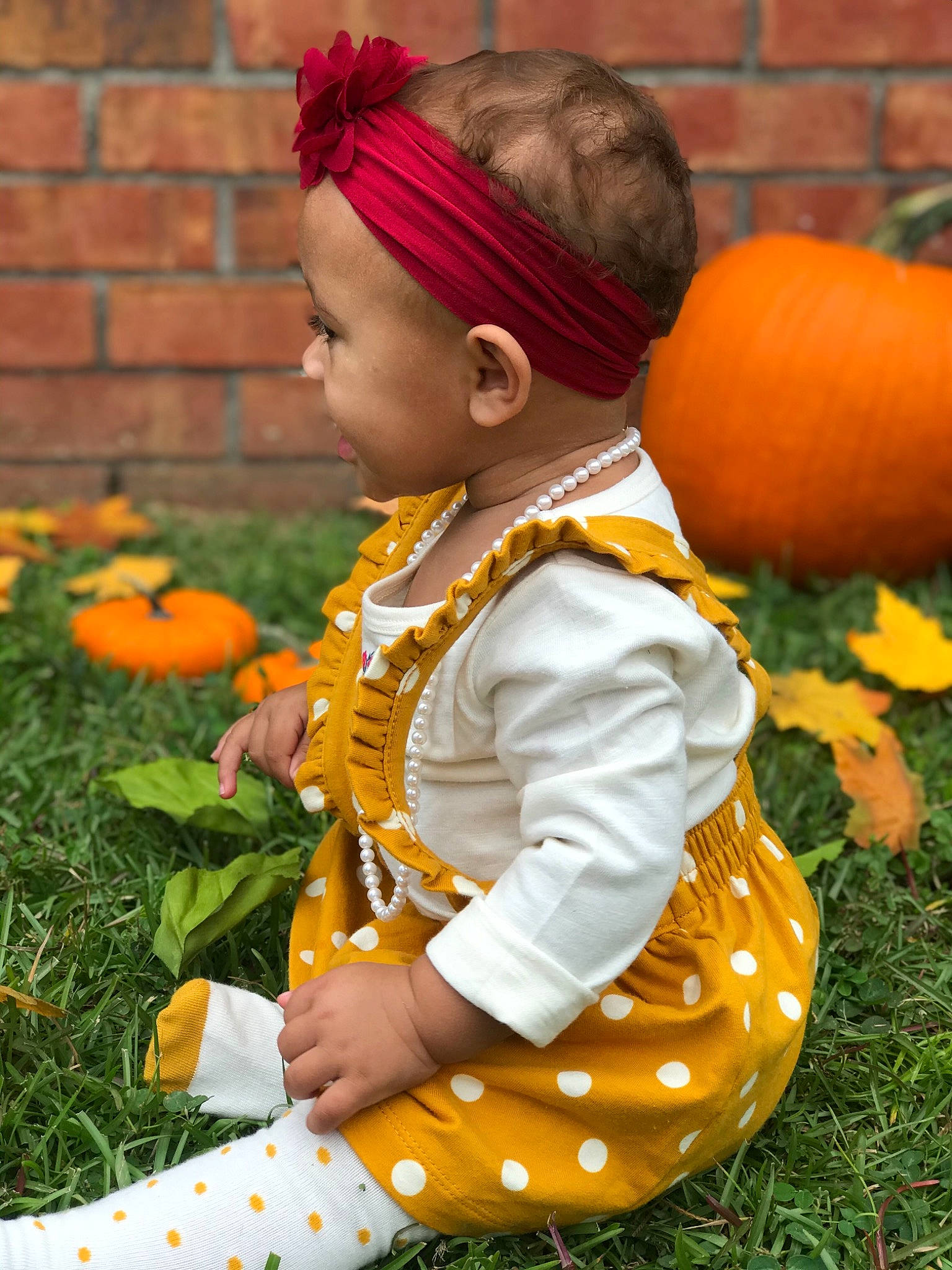 Kylance joined the competition — help win amazing prizes! child, grass, orange, person, plant, pumpkin, sitting, toddler, tradition, yellow