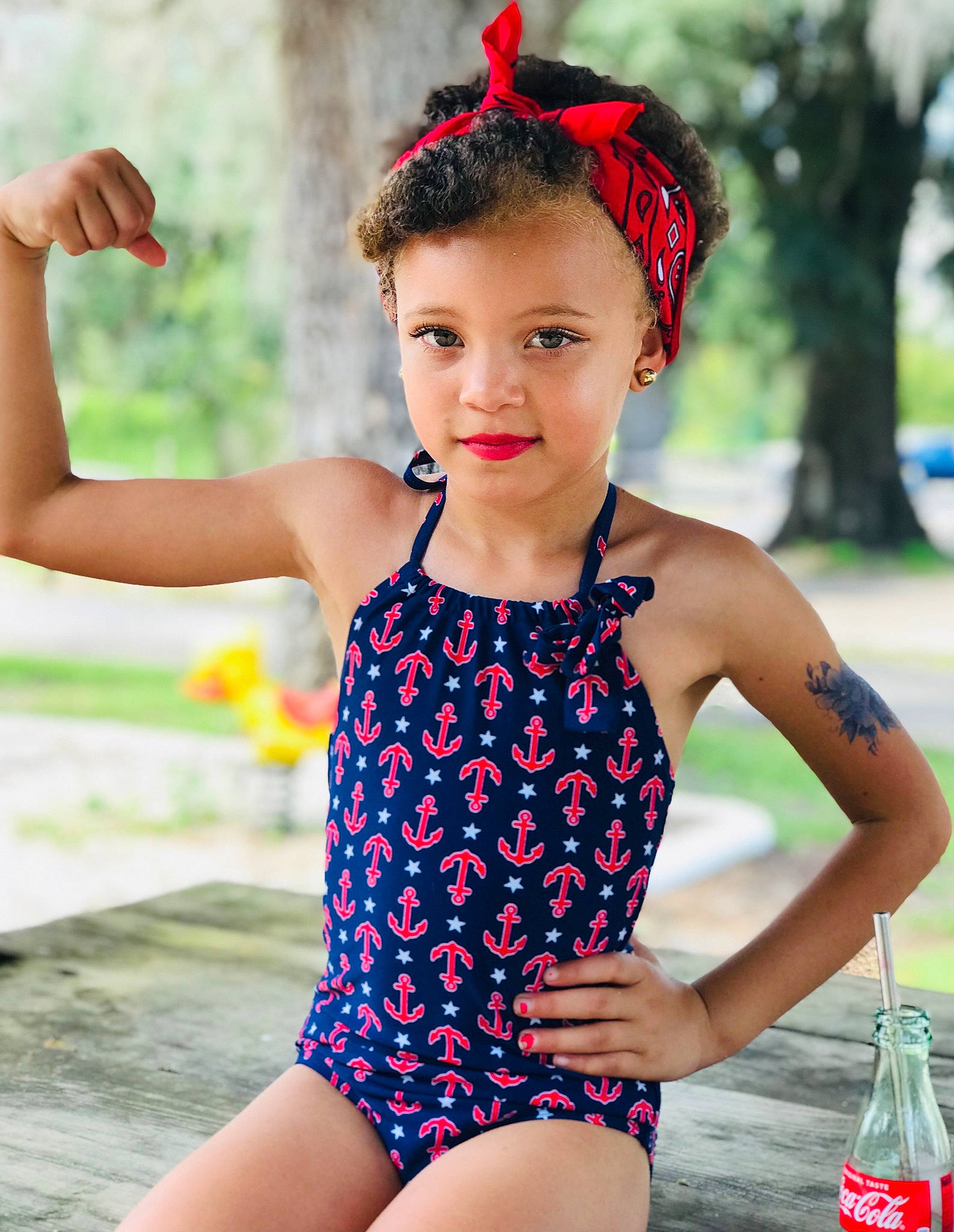 Paisley is registered to the contest to win money with this photo: beauty, bottle, electric_blue, happy, leisure, leotard, maillot, neck, one_piece_swimsuit, orange, person, photograph, red, shoulder, summer, swimwear, thigh, toddler, waist, water_bottle