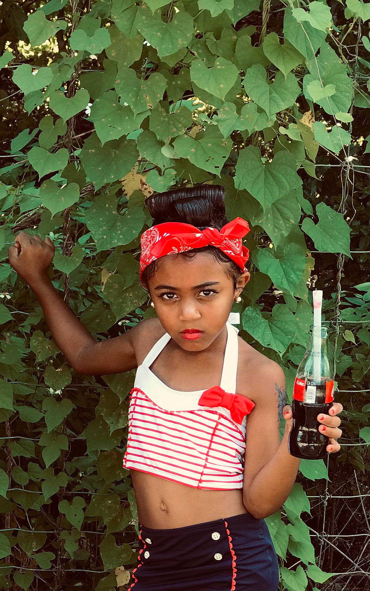 Cheyenne joined the competition — help win amazing prizes! baseball_cap, belt, botany, bottle, cap, child, fashion_accessory, grass, hand, headwear, jewellery, leaf, pattern, people_in_nature, person, photograph, plant, snapshot, standing, t_shirt