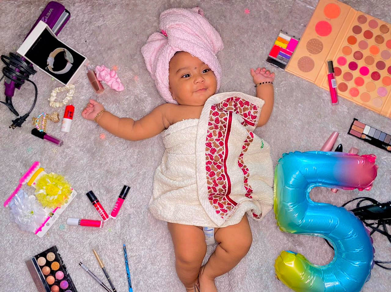 Ariya is registered to the contest to win money with this photo: baby, baby_toddler_clothing, baby_toys, beauty, cap, child, design, fashion_accessory, finger, fun, gadget, headwear, magenta, pattern, person, pink, play, product, room, snapshot