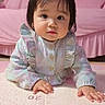 baby, child, infant, portrait, sitting, indoor, pink, pastel, bow, headband, dress, ruffles, long_sleeves, table, book, measurement_chart, bedroom, furniture, face, looking_at_camera