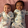 Zariyah N Saliyah is registered to the contest to win money with this photo: baby, infant, child, smiling, pajamas, blanket, lying_down, cute, happy, face, two_children, matching_clothes, indoors, skin, portrait, newborn, sibling, sleepwear, toddler, playful