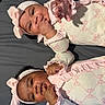 Zariyah N Saliyah joined the competition — help win amazing prizes! baby, infant, twin, matching_outfits, headband, pink_clothing, cute, smiling, lying_down, hand, face, skin, bed, blanket, adorable, child, portrait, happy, indoor, person