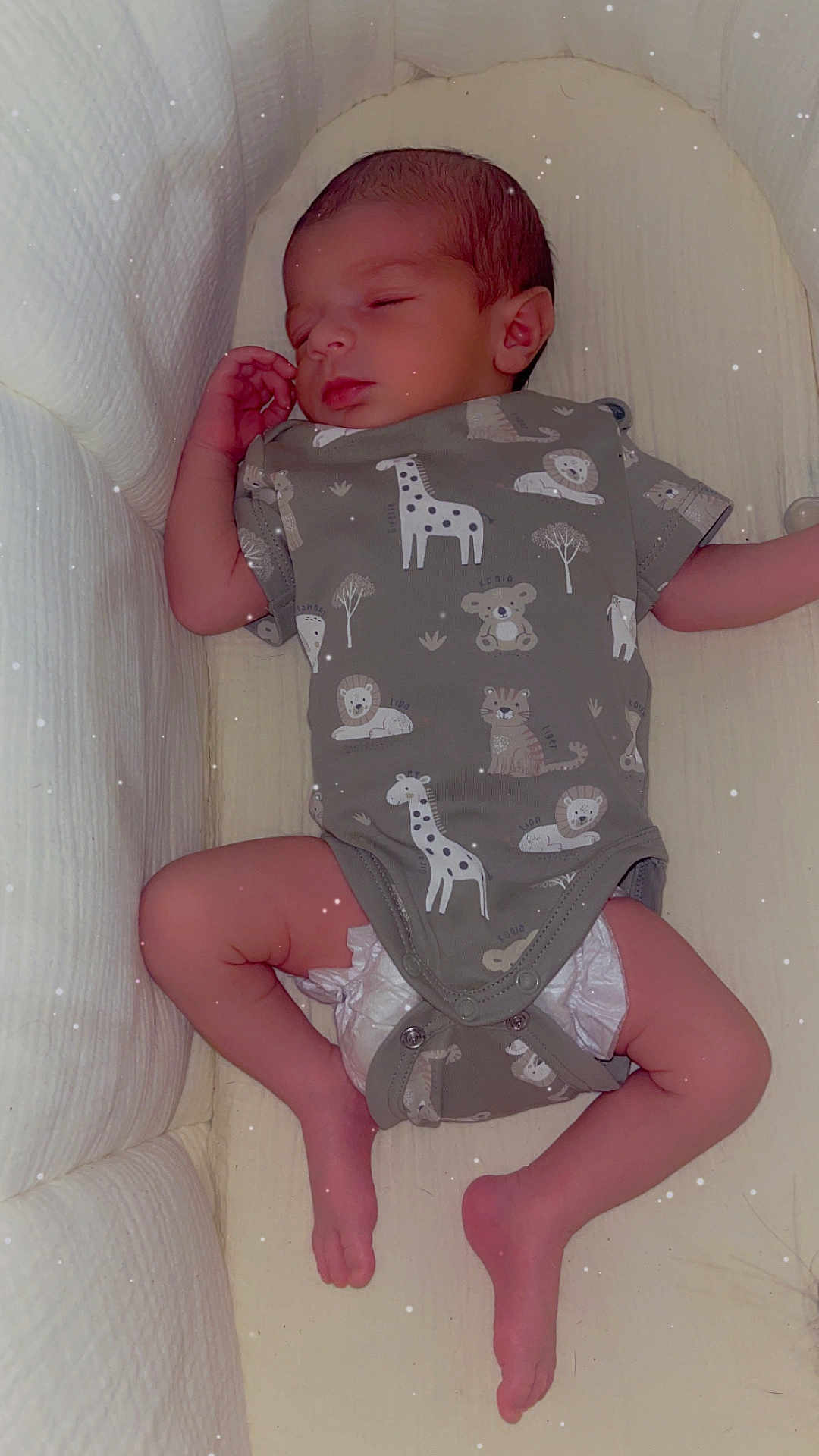 Kays participe au concours pour gagner de l'argent avec cette photo : baby, sleeping, onesie, animal_print, crib, infant, newborn, padded, cozy, soft, peaceful, resting, child, cute, diaper, foot, hand, face, indoors, portrait