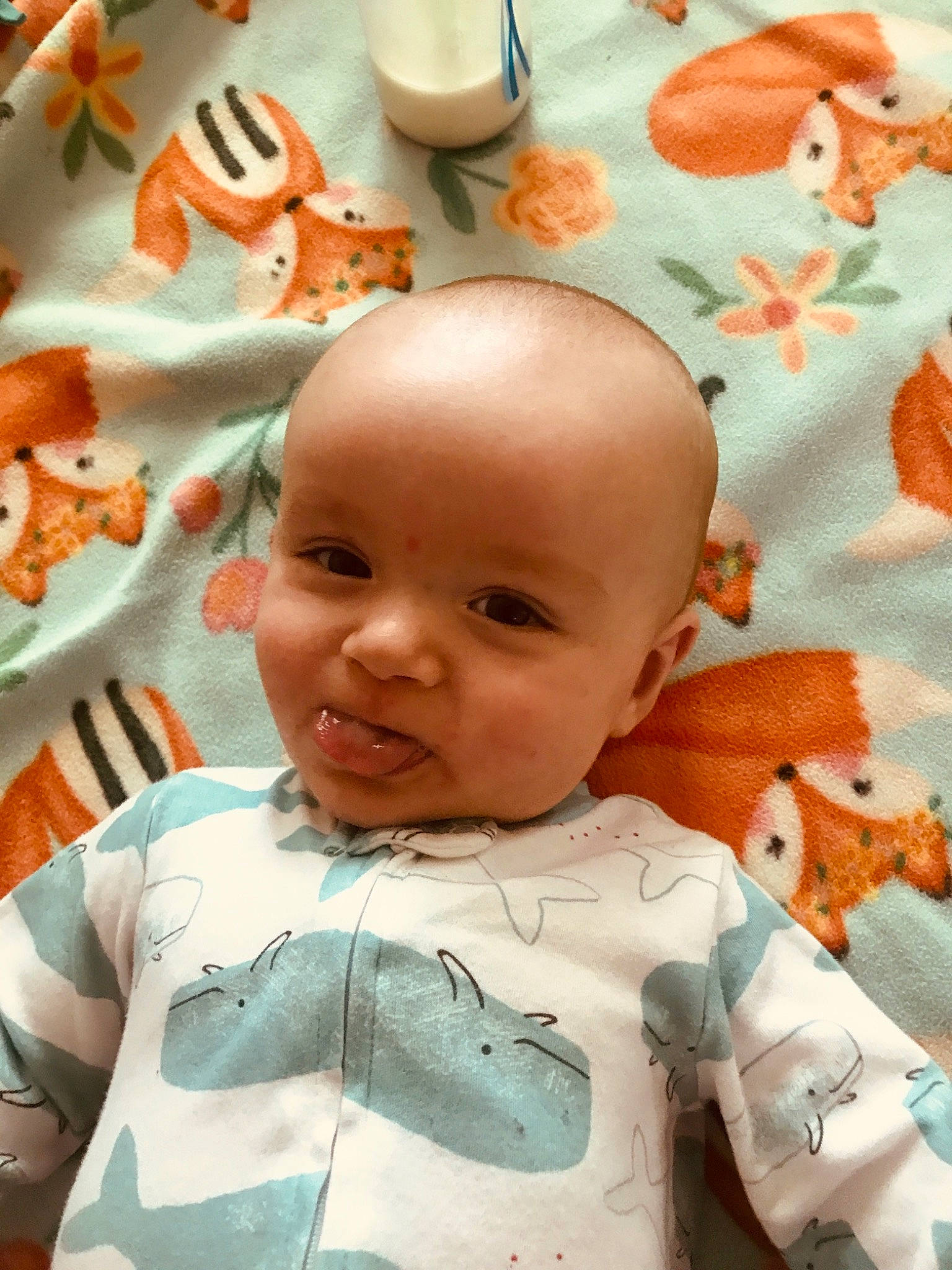 Laine is registered to the contest to win money with this photo: baby, baby_toddler_clothing, cheek, chin, eyebrow, face, forehead, green, happy, mouth, nose, orange, person, pink, product, skin, sleeve, smile, standing, textile