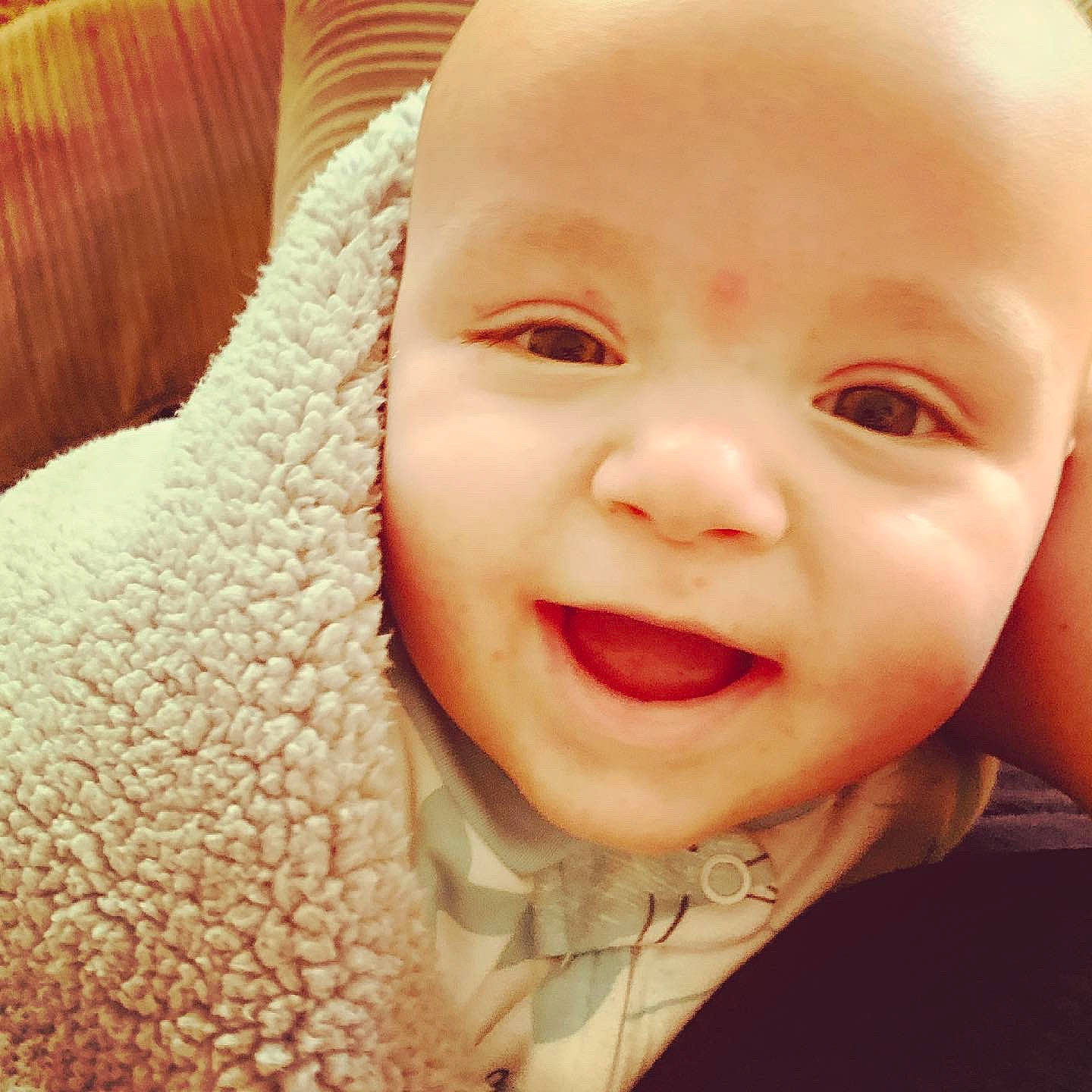 Laine is registered to the contest to win money with this photo: baby, cheek, chin, ear, eye, eyebrow, face, forehead, gesture, hairstyle, happy, head, iris, lip, mammal, mouth, nose, outerwear, person, skin