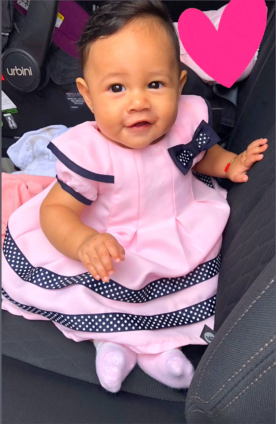 Melanie is registered to the contest to win money with this photo: baby, baby_carriage, baby_products, baby_toddler_clothing, beauty, car_seat, cheek, child, child_model, ear, eye, face, head, person, pink, product, sitting, skin, smile, toddler