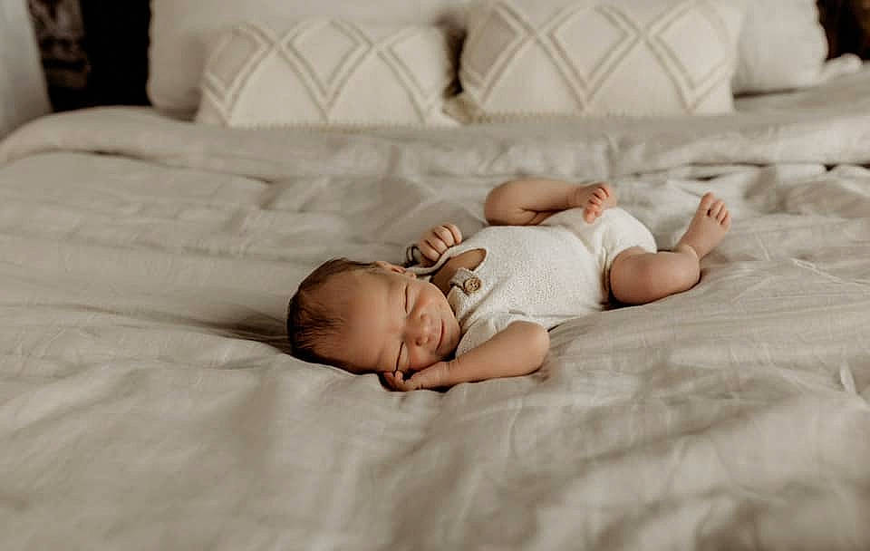 Myles joined the competition — help win amazing prizes! baby, bedding, bedtime, child, comfort, couch, eye, face, flash_photography, floor, flooring, grass, hair, head, human_body, linens, person, room, skin, textile