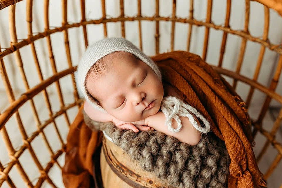Myles is registered to the contest to win money with this photo: baby, baby_products, baby_safety, baby_sleeping, baby_toddler_clothing, child, comfort, cradle, face, grass, infant_bed, linens, pattern, person, product, sitting, skin, toddler, white, wicker