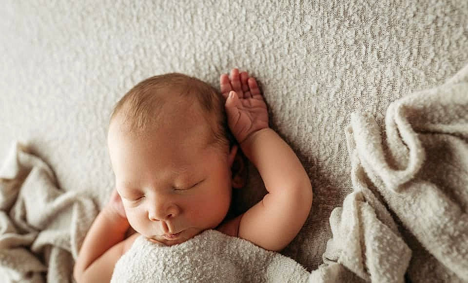 Myles is registered to the contest to win money with this photo: baby, baby_sleeping, baby_toddler_clothing, beauty, bedding, cheek, child, close_up, comfort, fashion_accessory, finger, linens, nose, pattern, person, room, skin, textile, toddler, wood