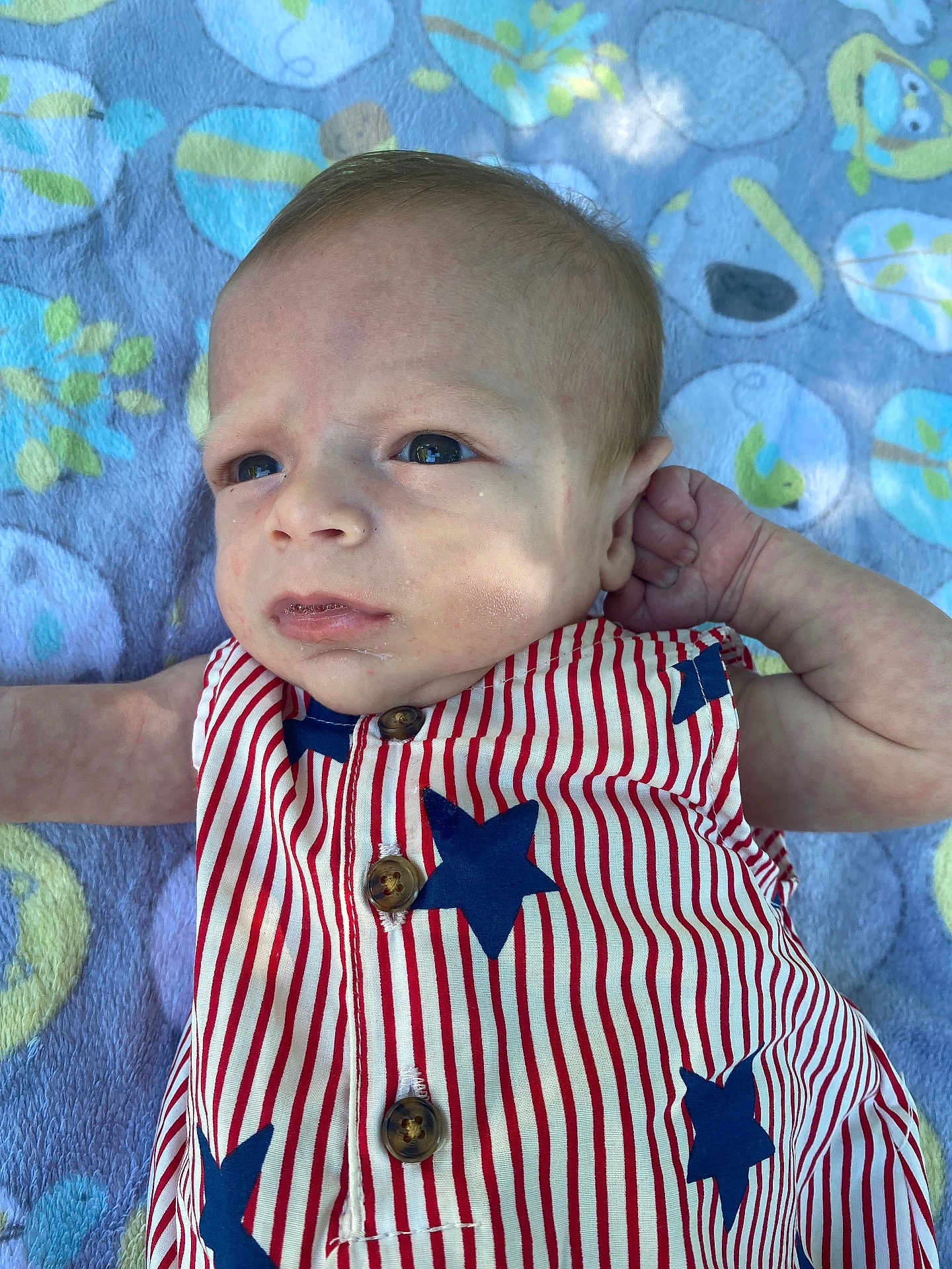 Kingston Ditoro joined the competition — help win amazing prizes! baby, infant, face, clothing, striped, stars, blanket, pattern, blue, red, white, button, arm, skin, head, eyes, portrait, laying, child, cute